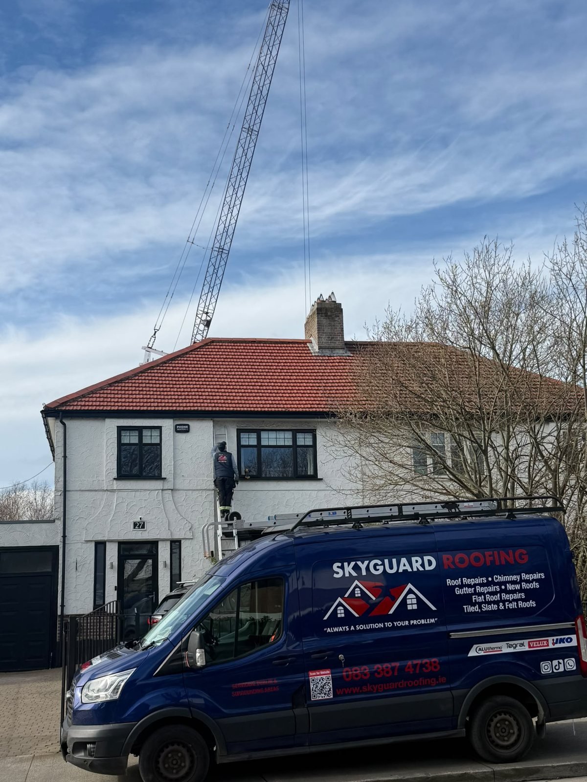 Skyguard Roofing van outside a Dublin home during a new roof installation